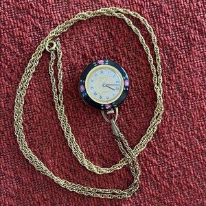 Elegant Gold Pendant Watch with Colorful Details